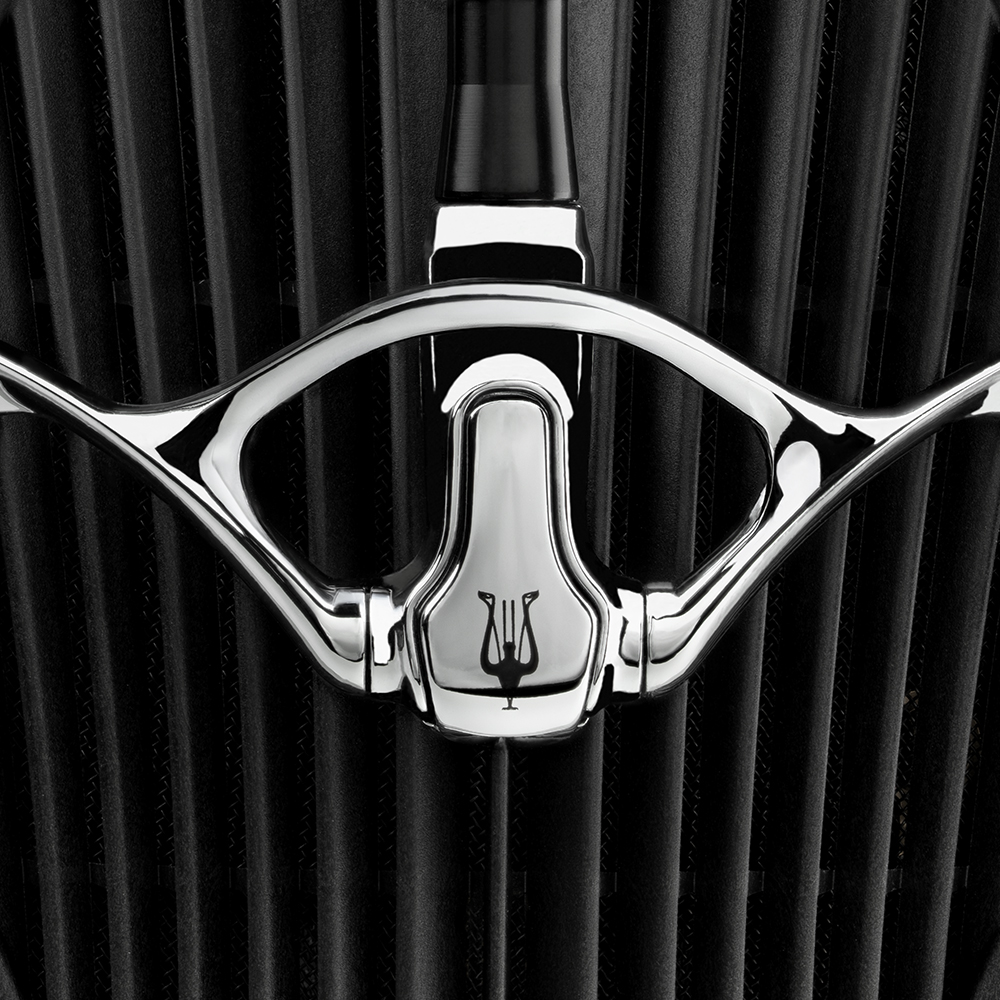 Chrome bracket with angled acoustic blades in the background from the Meze Audio ARTA flagship planar magnetic headphones