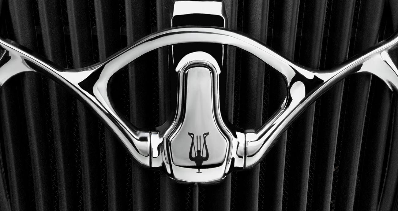Chrome bracket with angled acoustic blades in the background from the Meze Audio ARTA flagship planar magnetic headphones